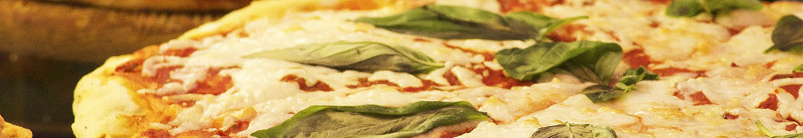 Eating Italian Pizza at Vinny's Italian Grill & Pizzeria restaurant in Fredericksburg, VA.
